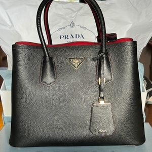 Brand new Prada Saffiano Black and Red two tone size small purse with crossbody
